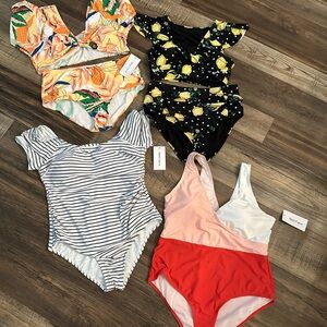 Set of four meet curve swim suits! All new with tags except the lemon swimsuit